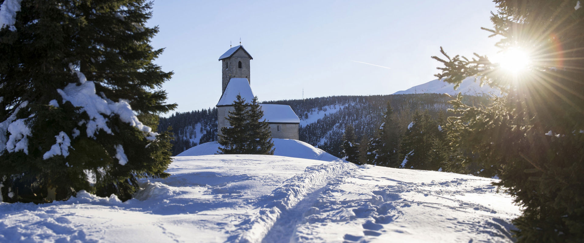 Snow covered church Small church in the middle of a white, snowy landscape.